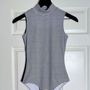Black and white stripped body suit